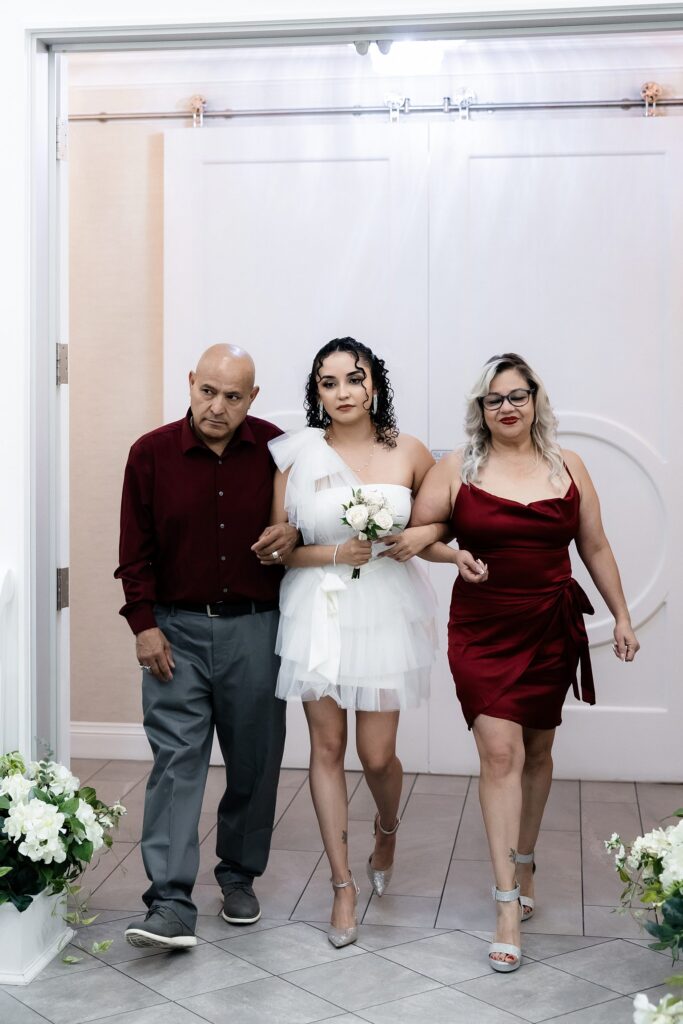 Bride being walked down the aisle for her Bliss Wedding Chapel Las Vegas elopement