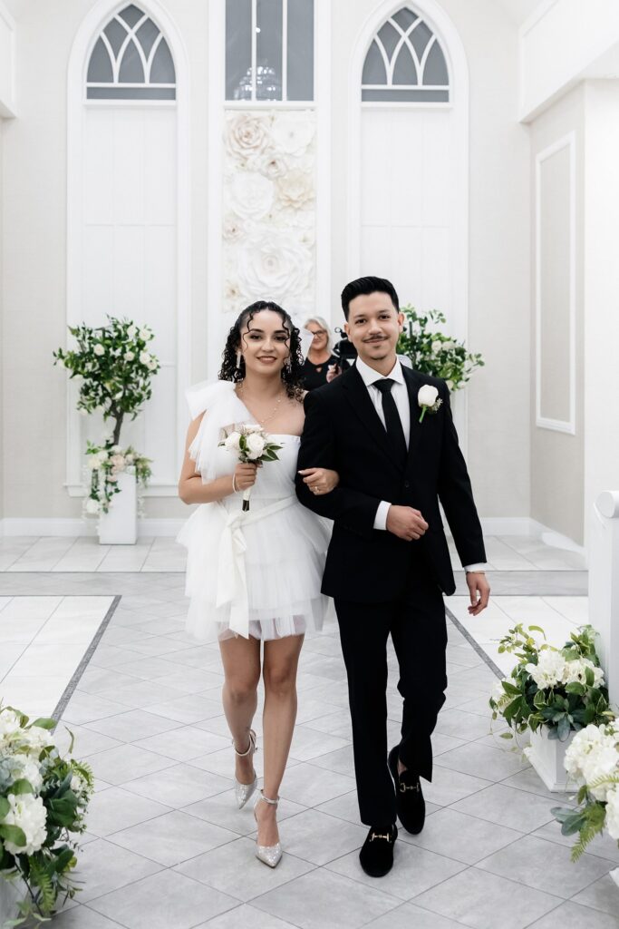 Bride and groom walking back down the aisle as husband and wife after their Bliss Wedding Chapel Las Vegas elopement