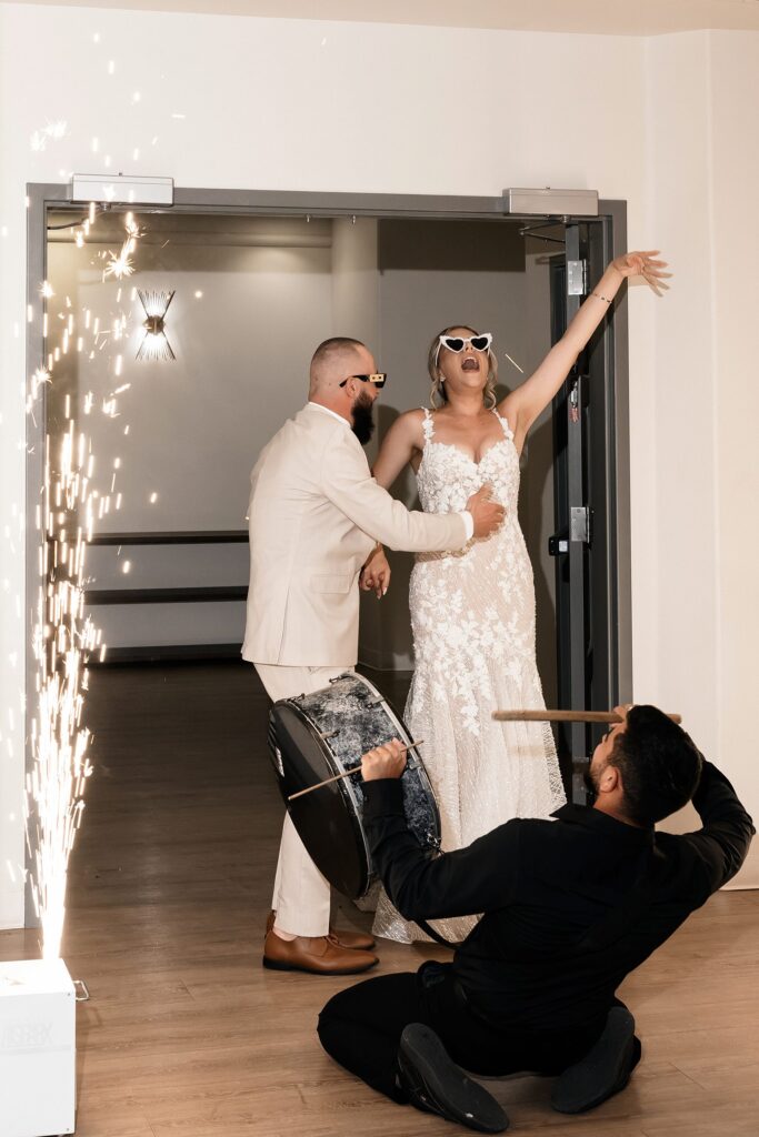 Bride and groom entering their Stallion Mountain wedding reception in The Citation Room 