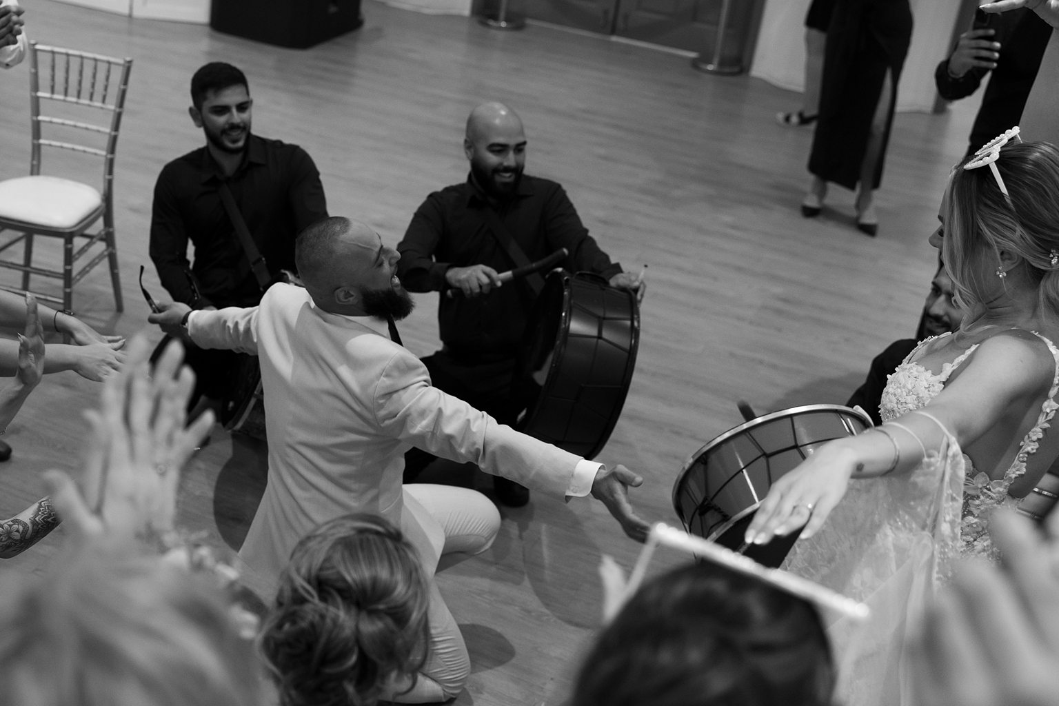 Bride and groom dancing during their wedding reception drum entrance