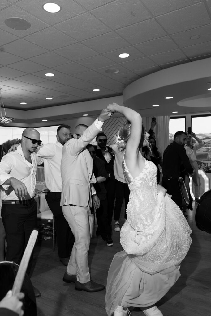 Bride and groom dancing during their wedding reception drum entrance