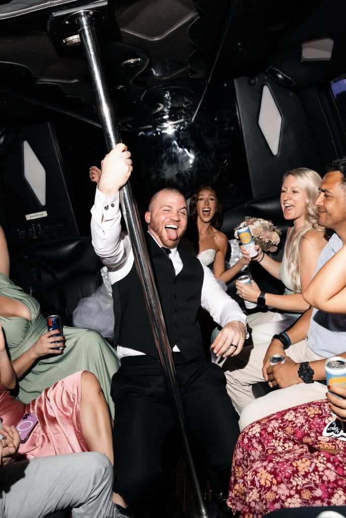 Groom dancing on the party bus