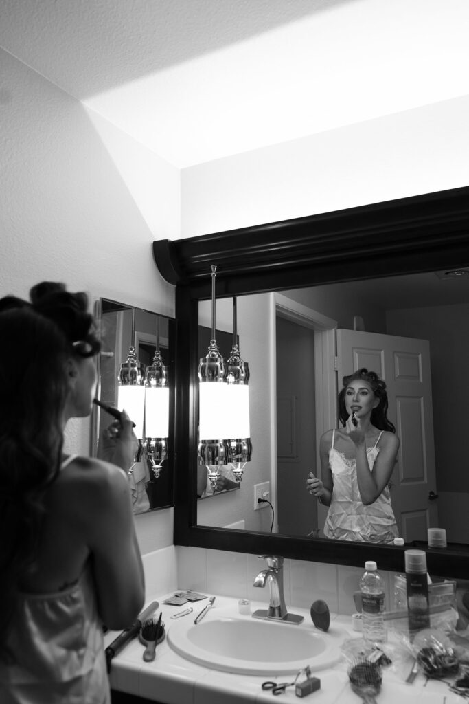 Black and white photo of a bride getting ready