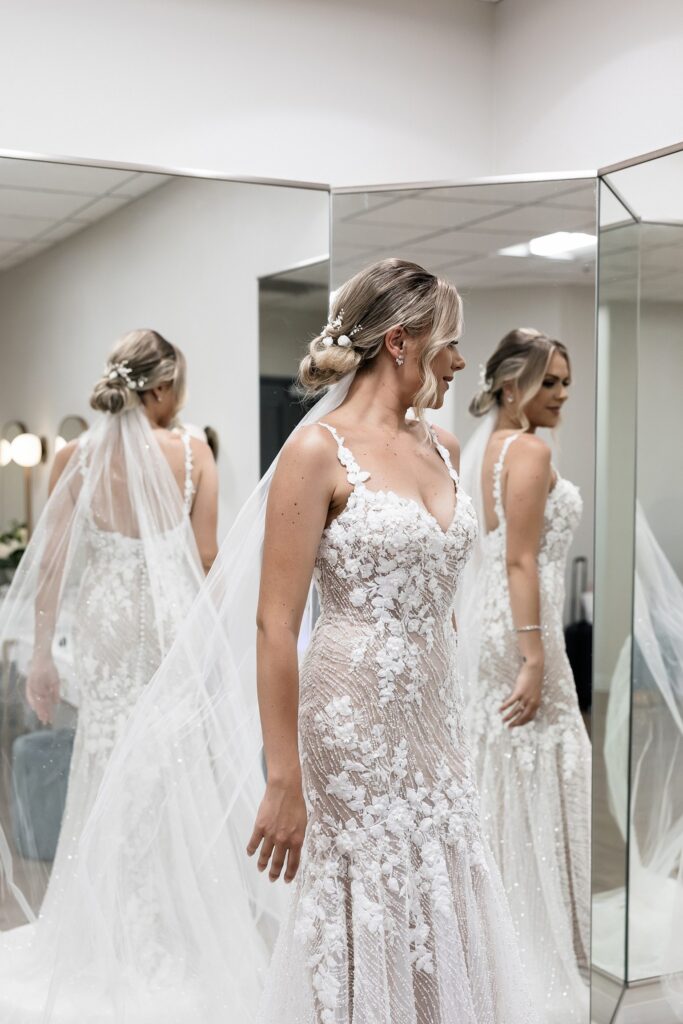 Bride looking at herself in the mirror