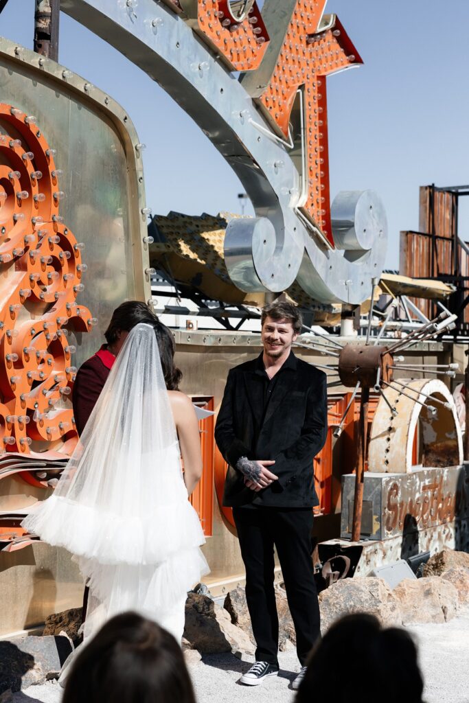 Bride and groom at the altar during their Las Vegas Neon Museum wedding ceremony