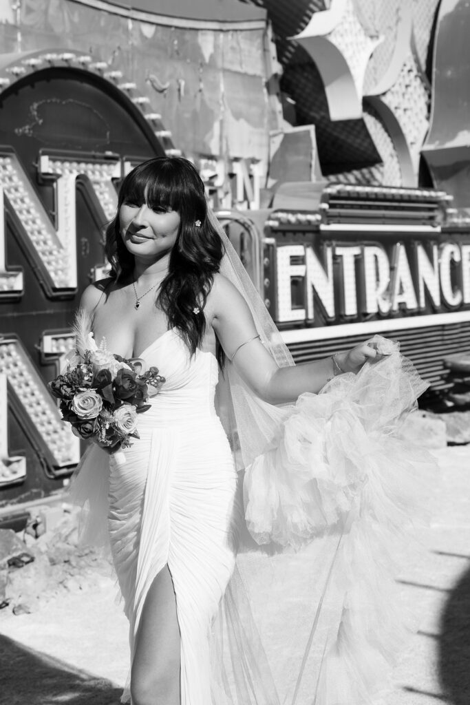 Black and white photo of a bride wearing her BHLDN Watters Lupine Wedding Dress