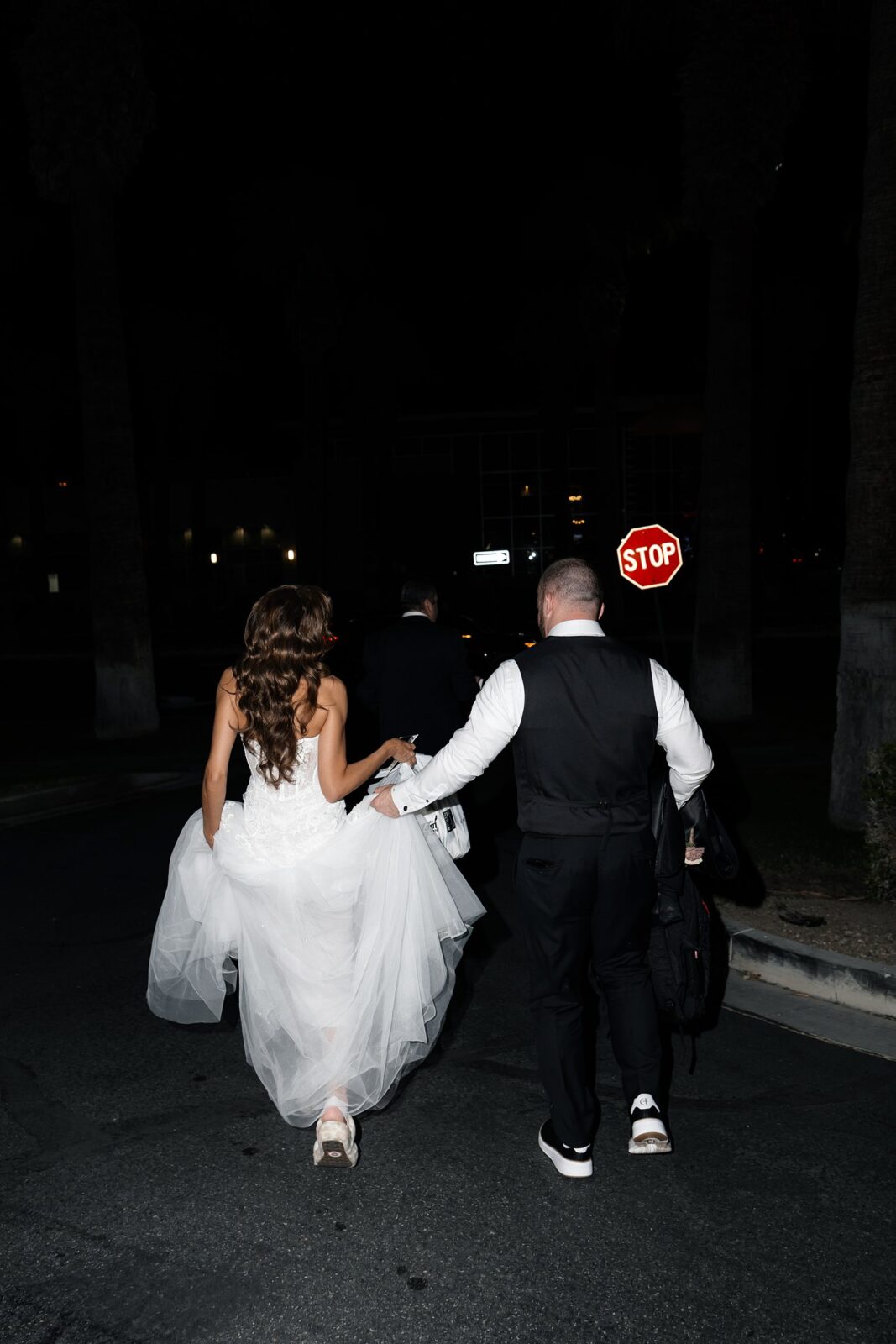 Bride and groom leaving their reception to go to the after party