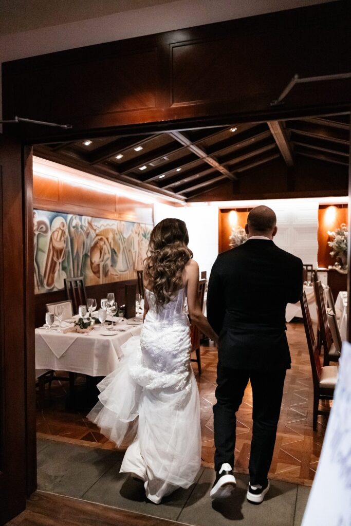 Bride and grooms room reveal for their indoor intimate wedding reception at Lawry's Steakhouse