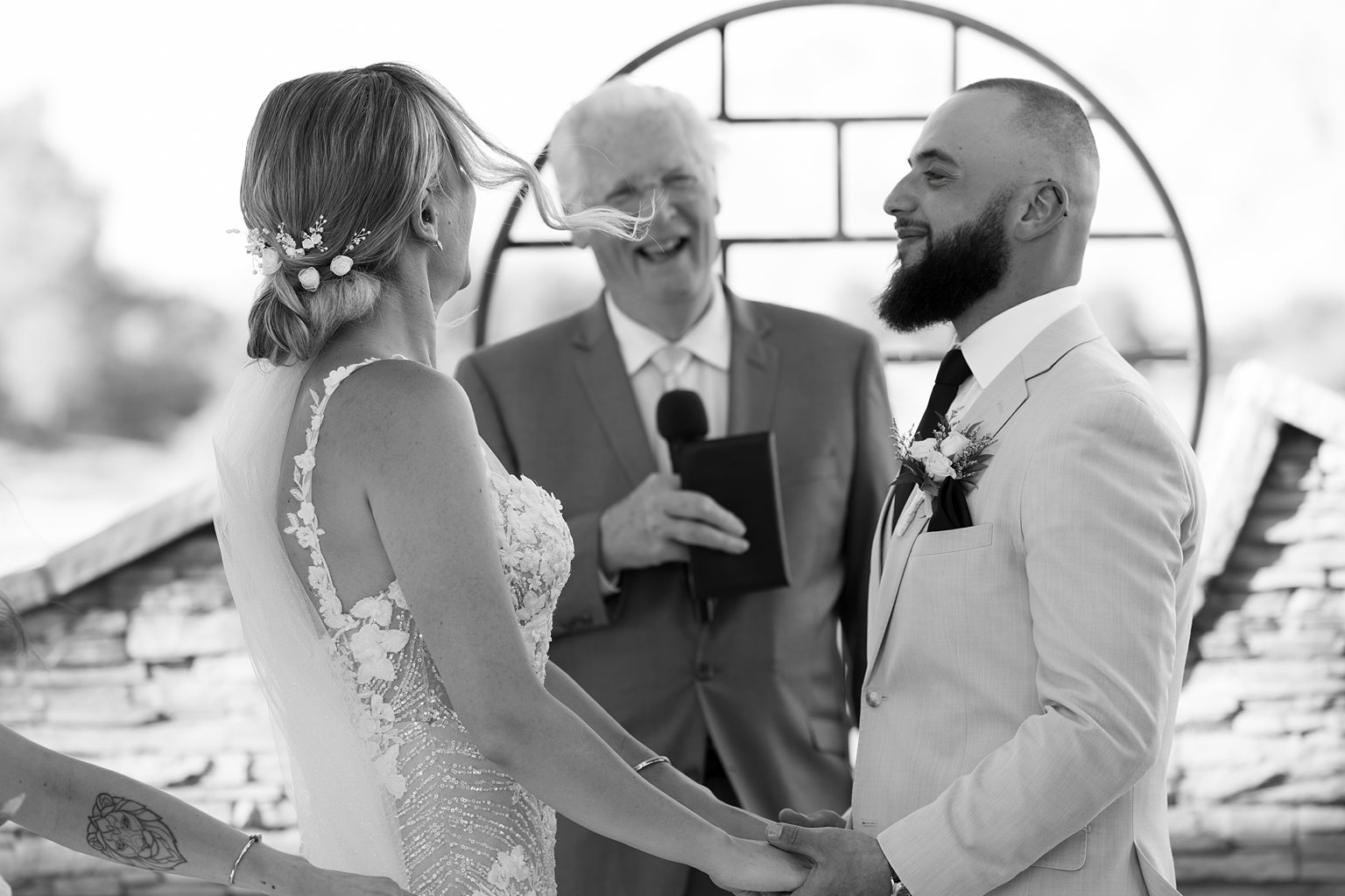 Black and white photo of a couple at the altar during their outdoor Stallion Mountain wedding ceremony on The Patio