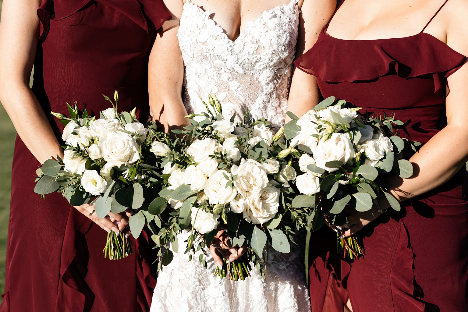 Bride and bridesmaids holding bouquets