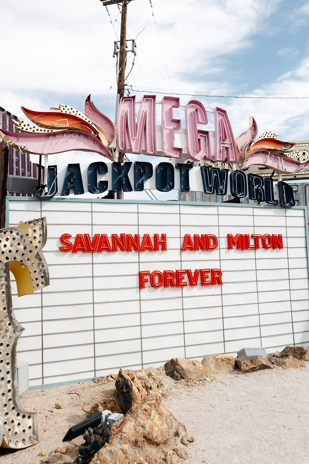 Custom marquee wedding sign at The Neon Museum that says "Savannah and Milton Forever"