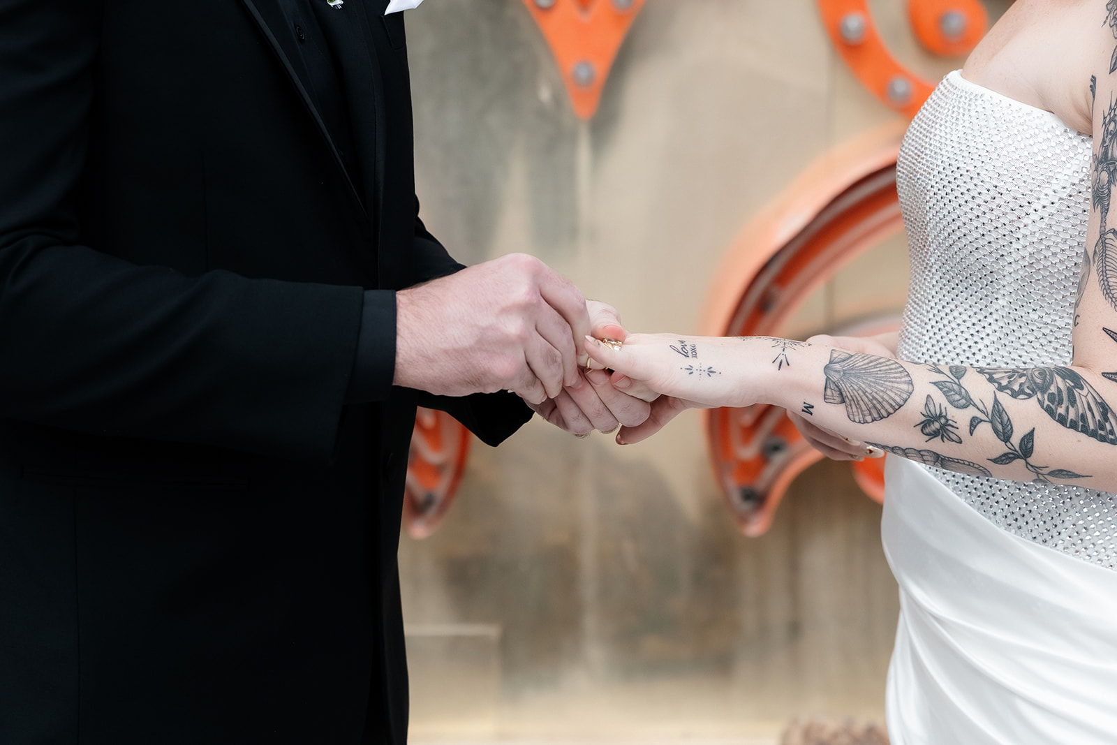 Bride and groom exchanging rings during their ceremony.