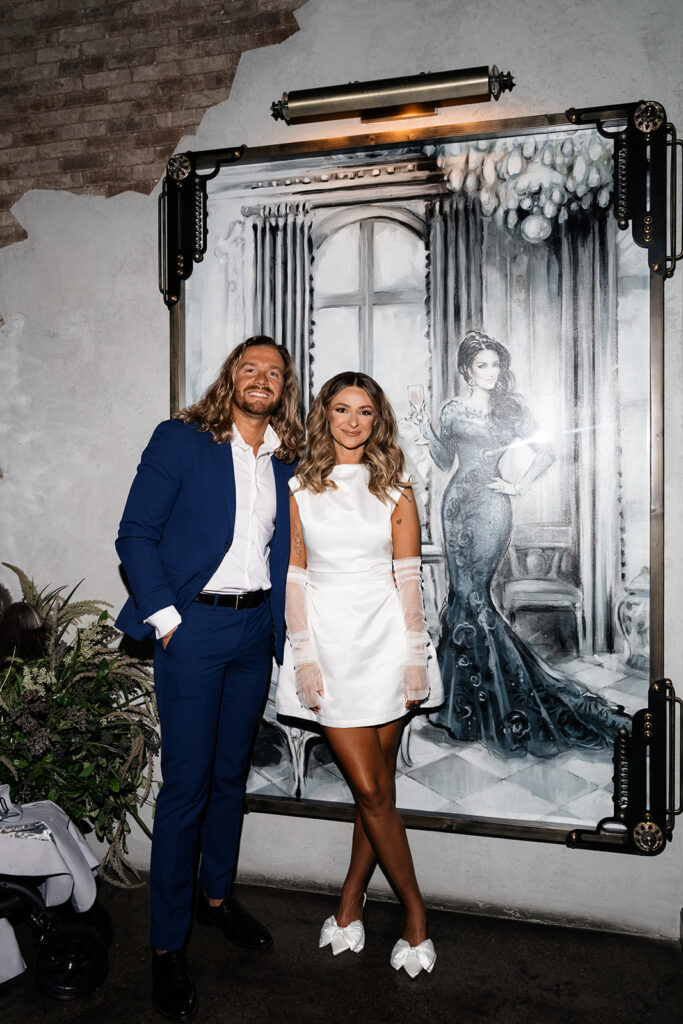 Bride and groom posing for their intimate Las Vegas wedding reception photos at Vanderpump