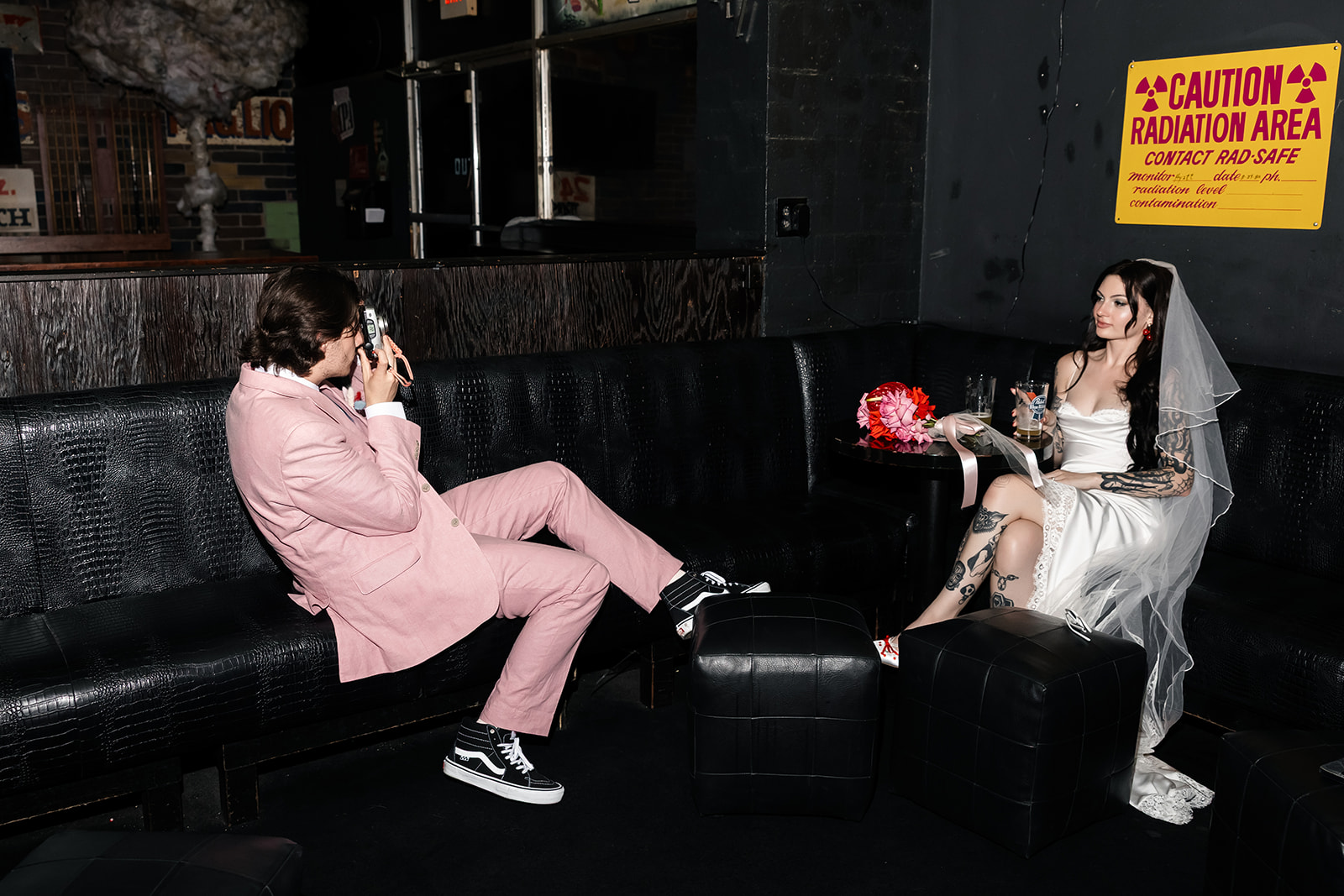 Couple having post-elopement drinks at Atomic-Liquors