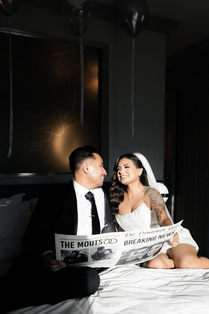 Bride and groom posing for photos in the Cosmopolitan Terrace Suite