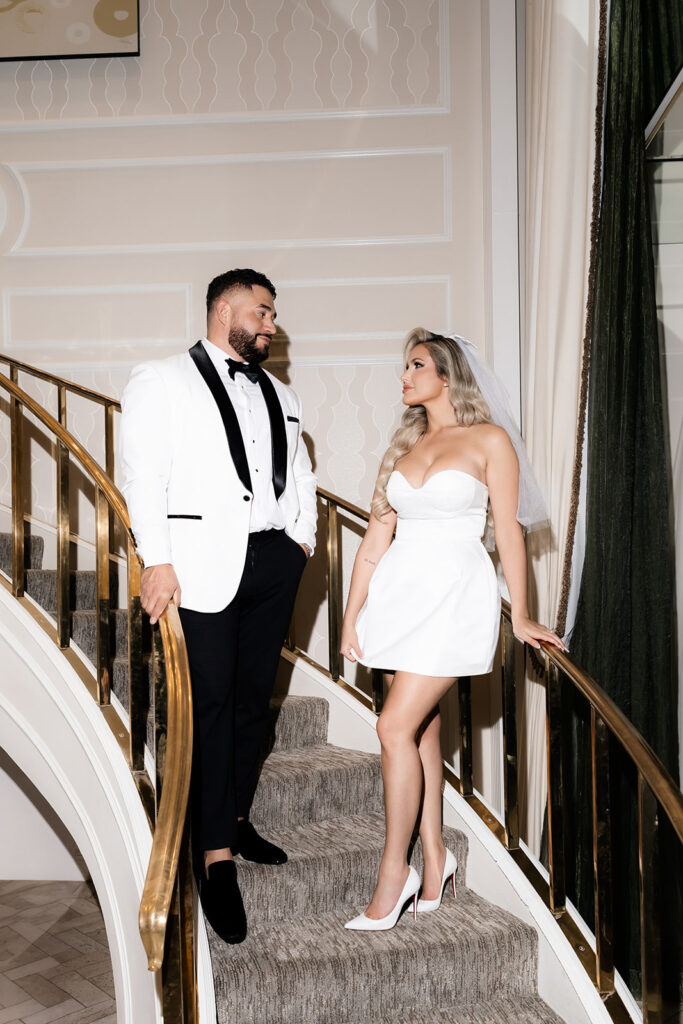 Couple posing on the stairs in their Golden Nugget Spa Suite in Las Vegas