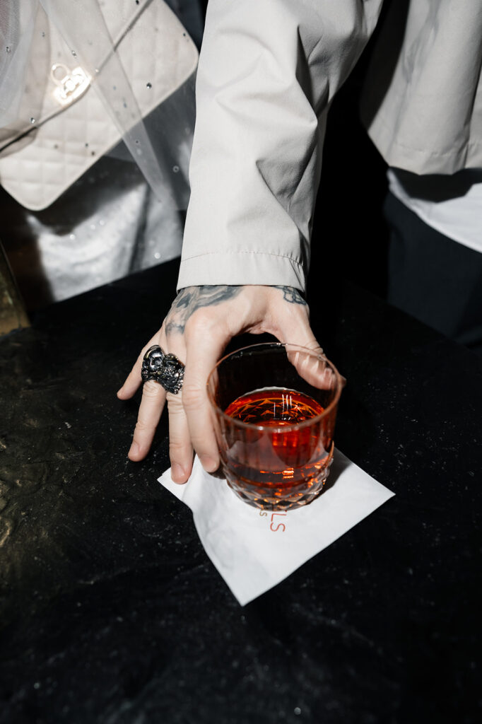 Groom having a drink at The Shag Room in Las Vegas