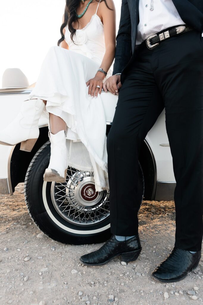 Close-up of a couple during their Las Vegas engagement session, showing off western details and desert sunlight.