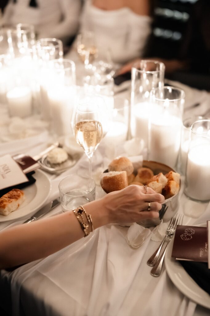 Guest grabbing bread during a Las Vegas micro wedding reception at Barry's Prime.
