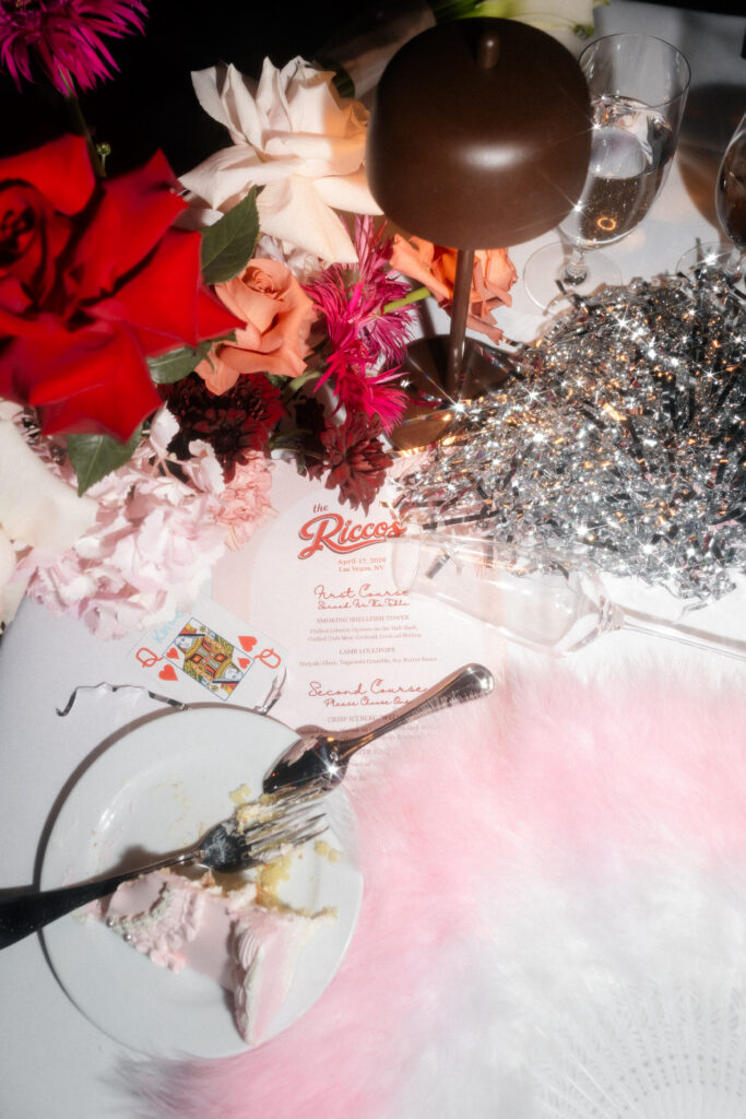 Las Vegas wedding reception detail shots with a menu, champagne flute, eaten cake, and more.