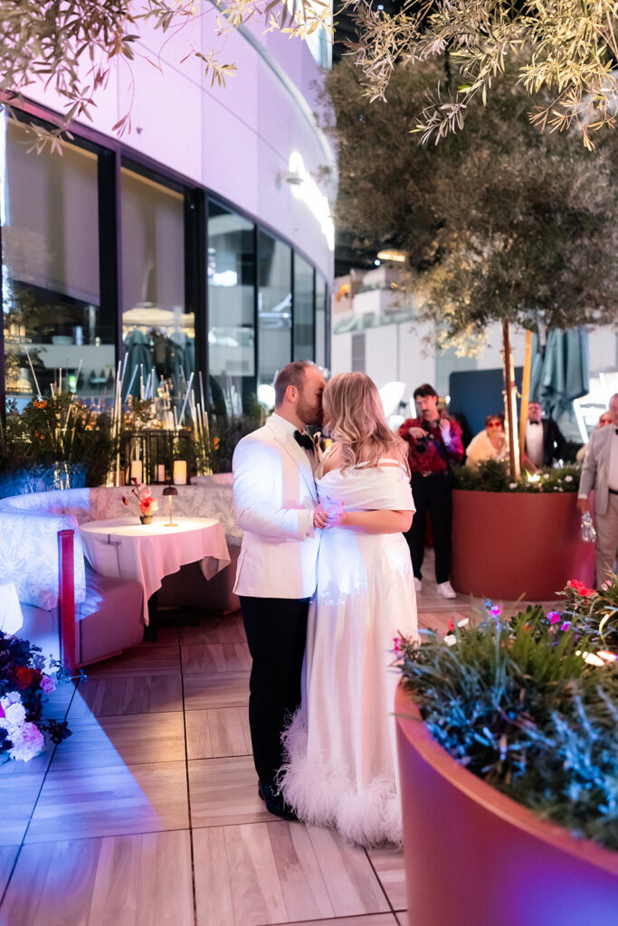 Bride and groom kissing during their first dance at Ocean Prime.