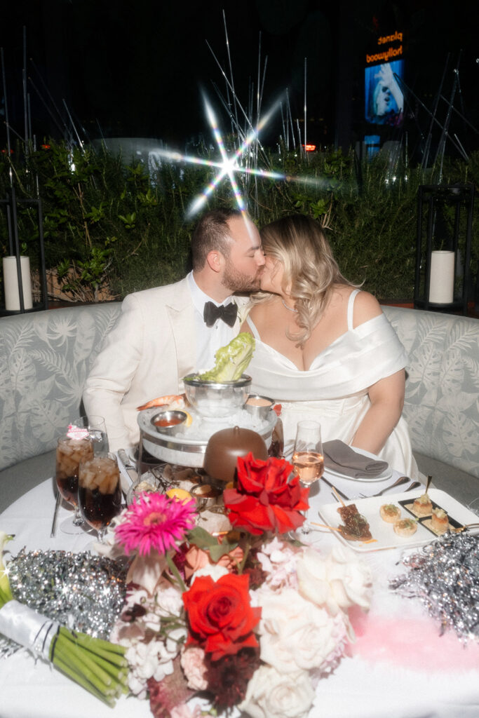 Bride and groom kissing during their Las Vegas wedding reception at Ocean Prime.