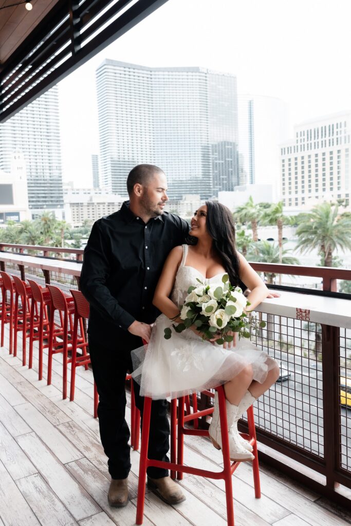 Bride and groom posing on the balcony at Ole Red in Las Vegas.