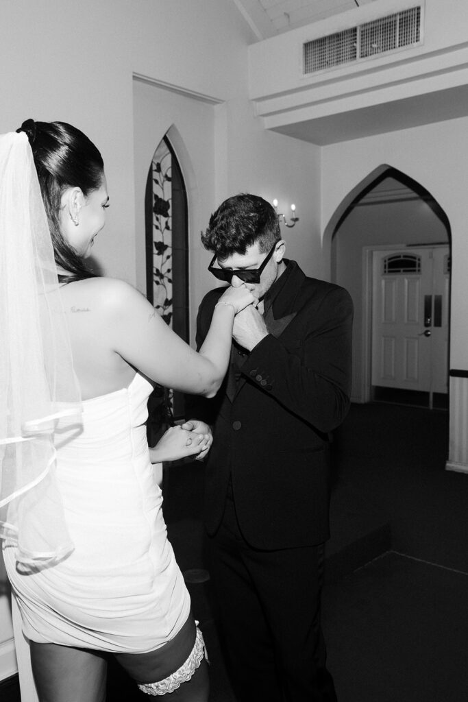 Robin Thicke kissing Aprils hand during their Las Vegas elopement ceremony at A Special Memory Wedding Chapel