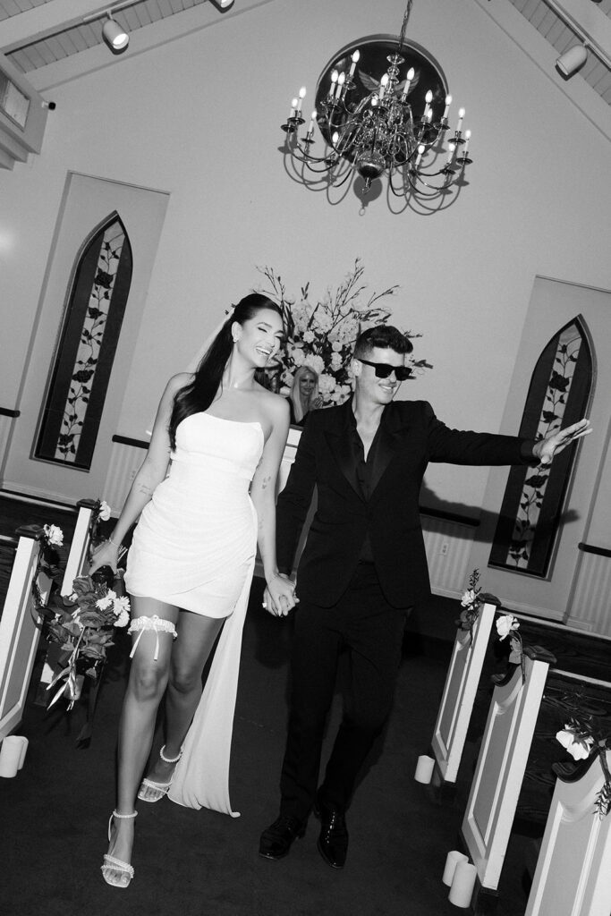 Robin Thicke and April Love Geary walking back down the aisle after their wedding ceremony at A Special Memory Wedding Chapel in Las Vegas