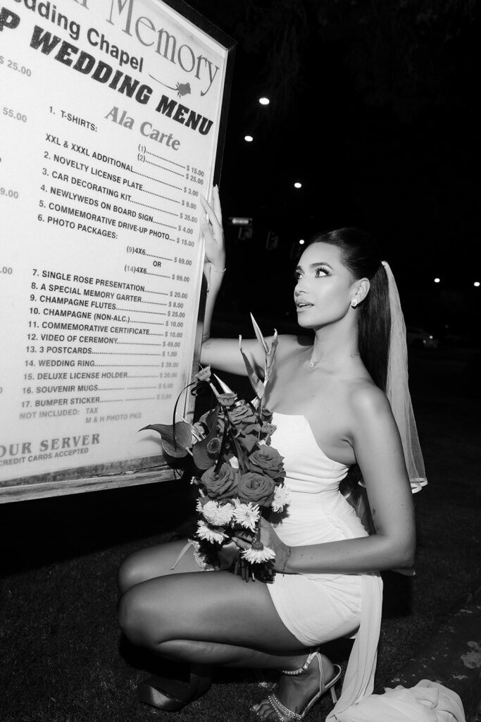 April Love Geary posing with the A Special Memory Wedding Chapel Menu