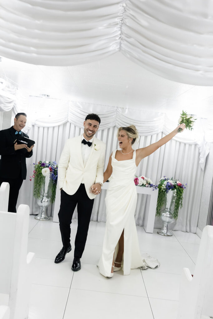 Bride and groom smiling after eloping at Little White Wedding Chapel in Las Vegas.