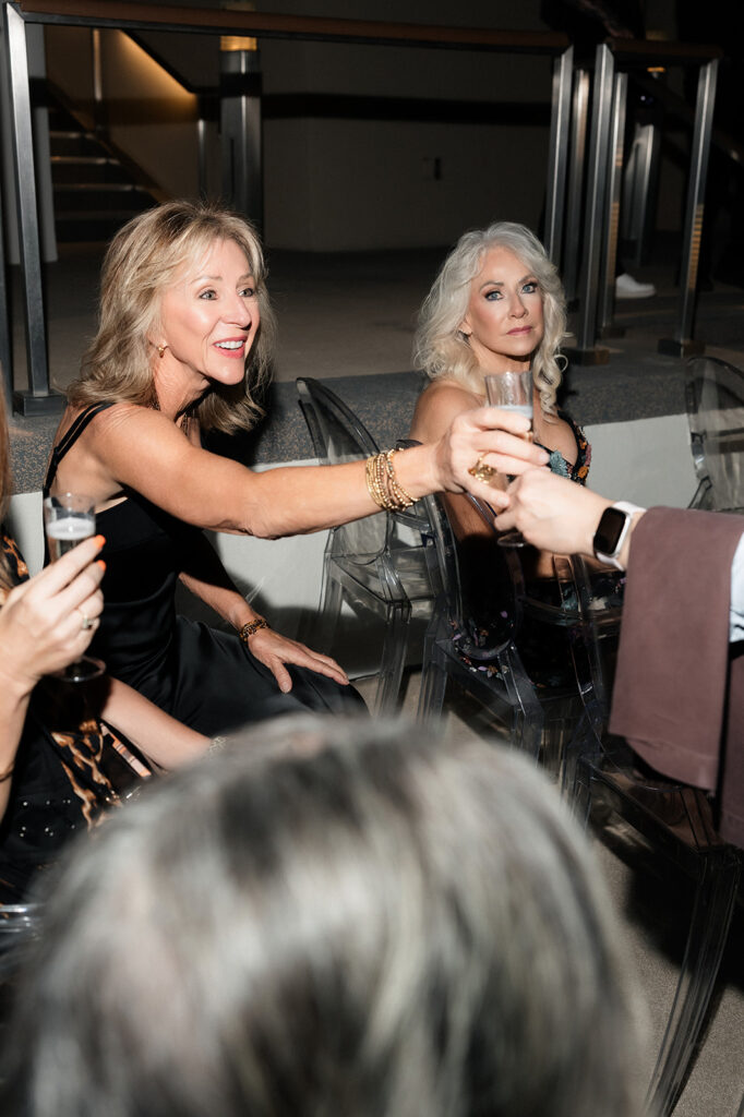 Guests seated during a nighttime ceremony on the Boulevard Pool Deck at The Cosmopolitan in Las Vegas.