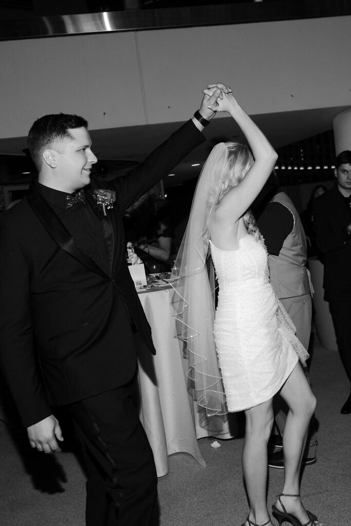 Bride and groom dancing together.