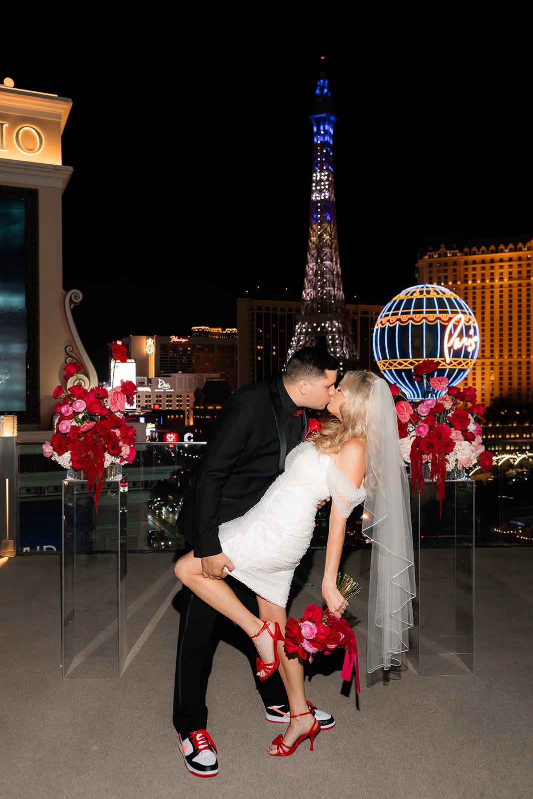 Bride and groom kissing during their Cosmopolitan wedding on the Boulevard Pool Deck in Las Vegas