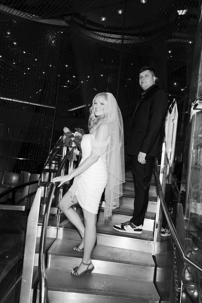 Bride and groom walking down a staircase at The Cosmopolitan in Las Vegas