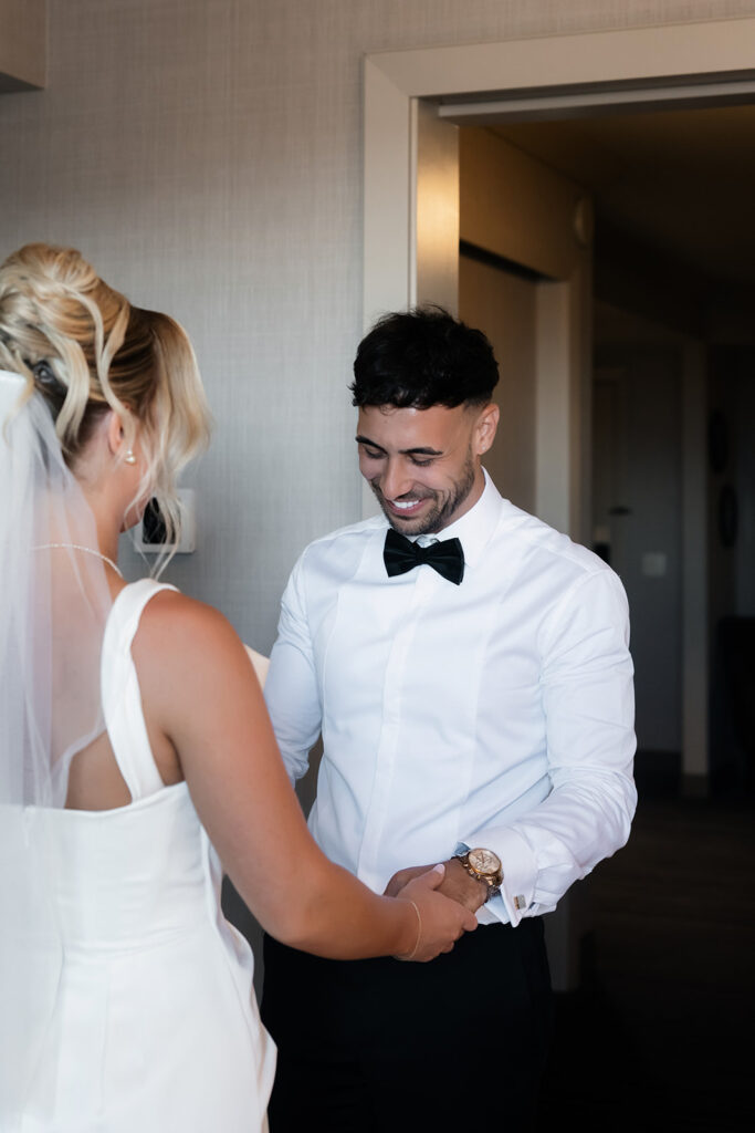 Groom seeing his bride for the first time during their first look at The Cosmopolitan. 