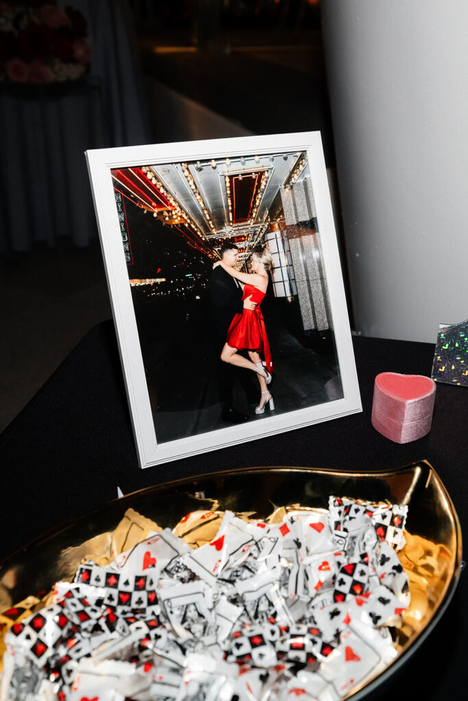 Framed photo of the couple displayed on a reception table.