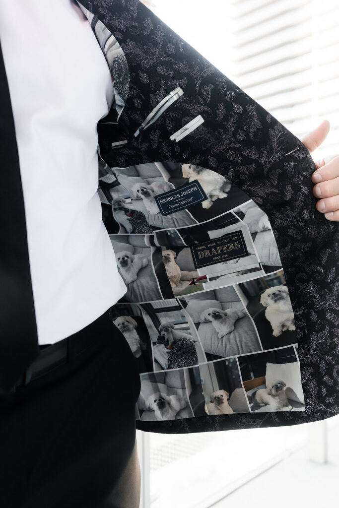 Groom showing custom suit lining during getting ready at The Cosmopolitan Las Vegas.