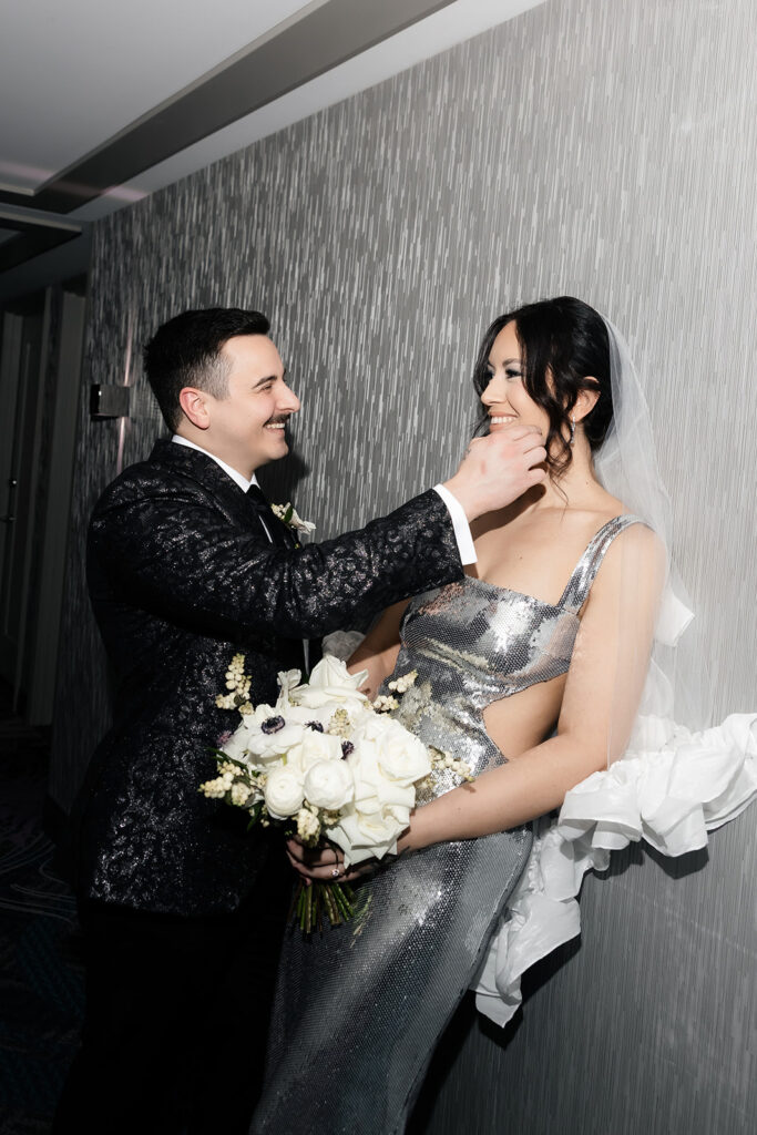 Bride and groom posing in the hallway at The Cosmopolitan Las Vegas.