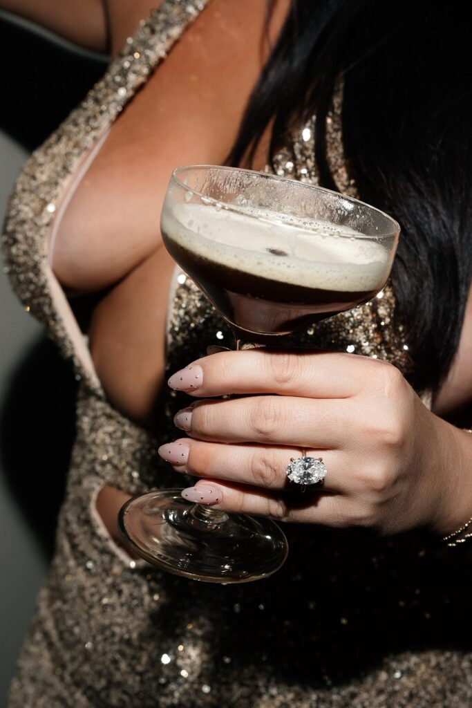 Bride holding an espresso martini.
