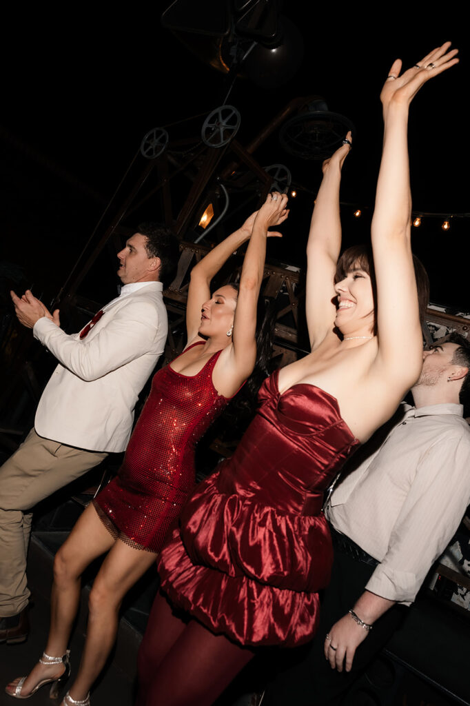 Guests dancing during a fun Las Vegas wedding reception on the rooftop of Commonwealth.