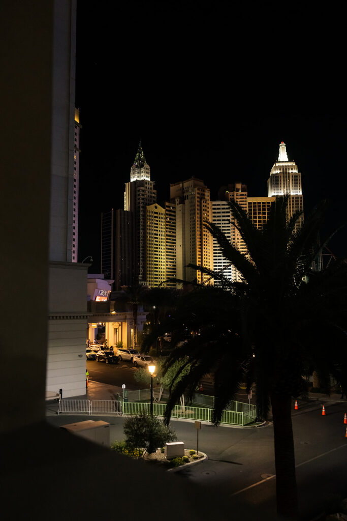 Las Vegas micro wedding reception details at NoMad Library, featuring nighttime views of the Strip from Park MGM.