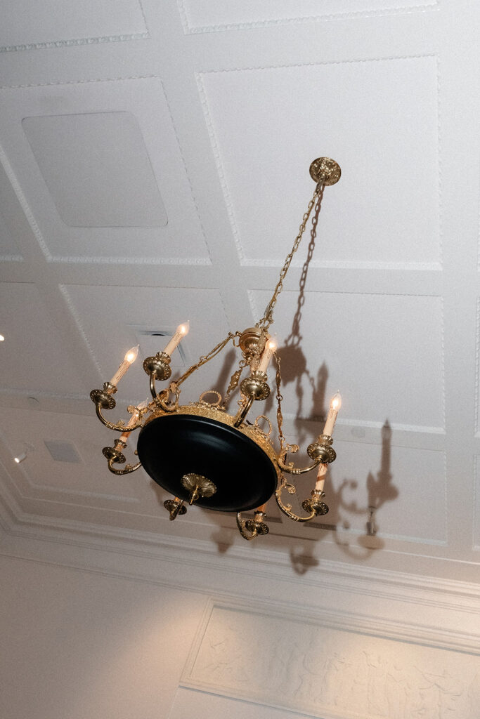 Chandelier detail inside the NoMad Library Parlour Room during a Las Vegas micro wedding reception.