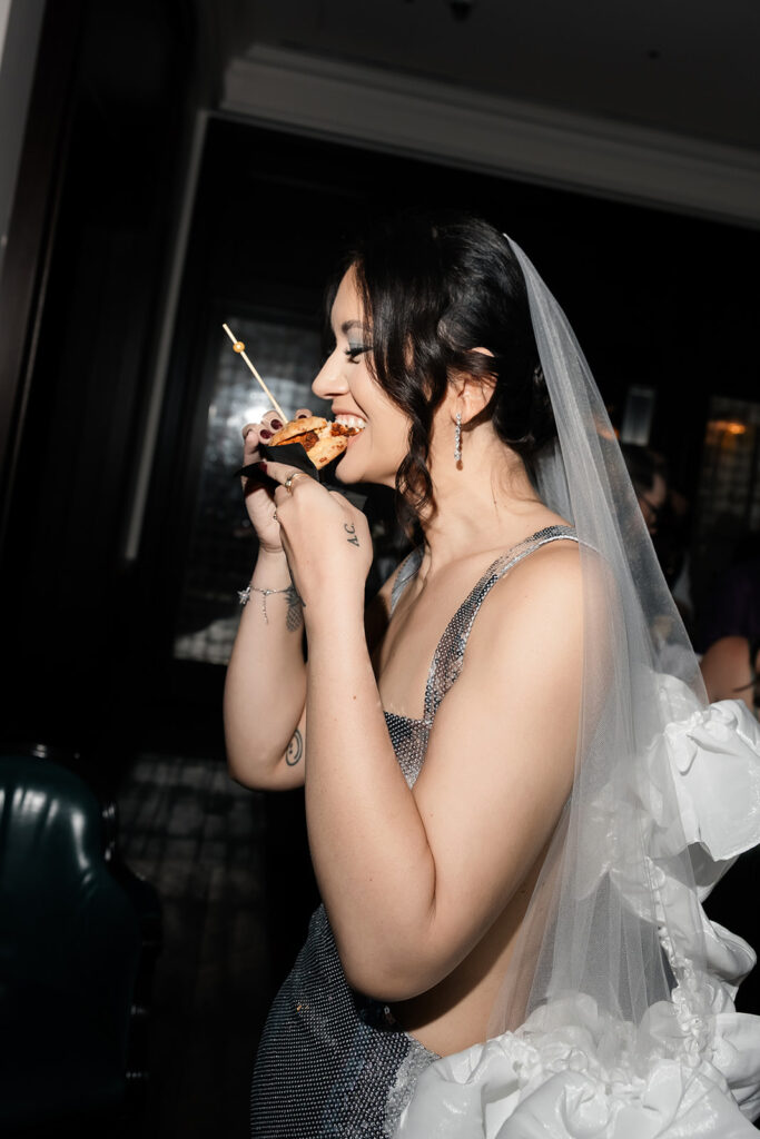 Bride enjoying late-night bites during her NoMad Library Las Vegas micro wedding reception in the Parlour Room at Park MGM.