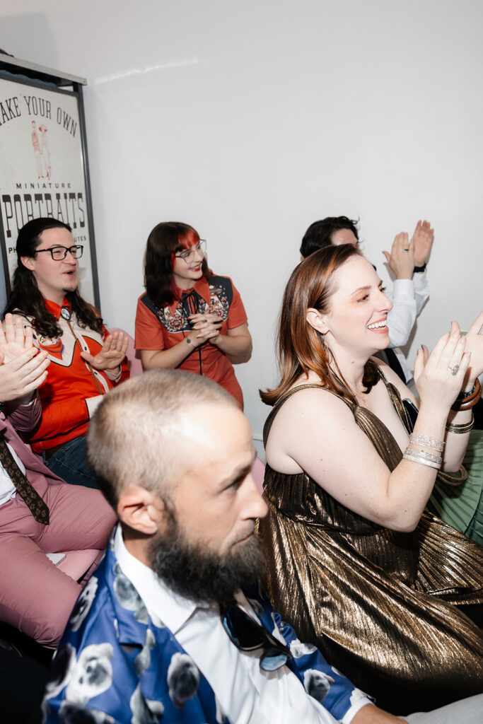 Guests clapping during a Sure Thing Chapel wedding ceremony.