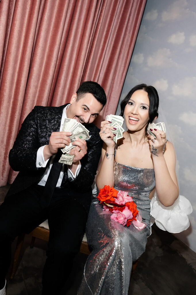 Bride and groom with dollar bills waiting for their Surely The Showgirl performance for their Las Vegas micro wedding ceremony at Sure Thing Chapel.