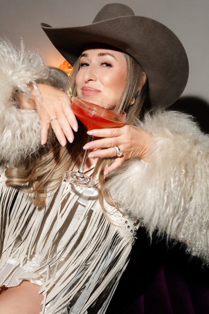 Bride having a drink during her western Las Vegas bachelorette party.