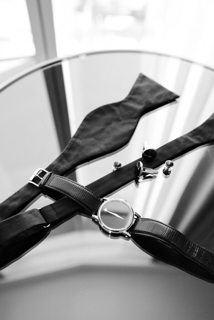 Black and white photo of the grooms wedding details.