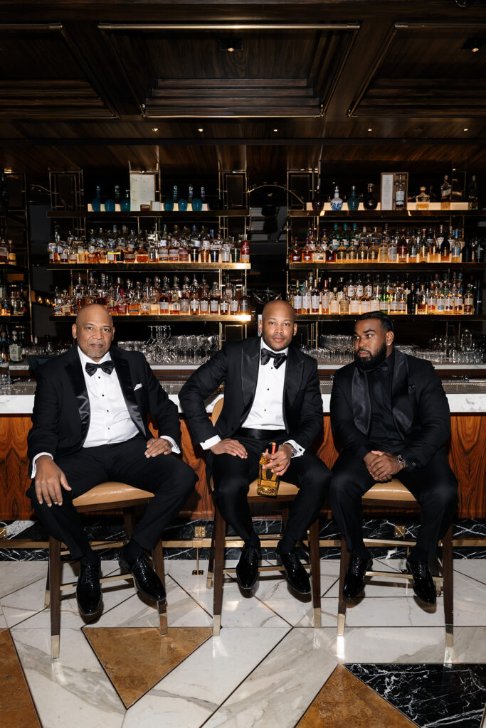 Editorial groom and groomsmen photo at the bar from a Wynn Las Vegas wedding.