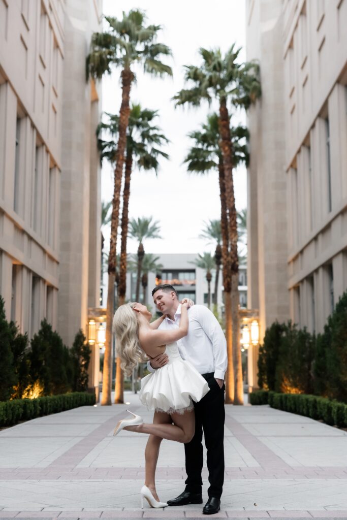Couple posing at The Smith's Center for their Las Vegas engagement photos.